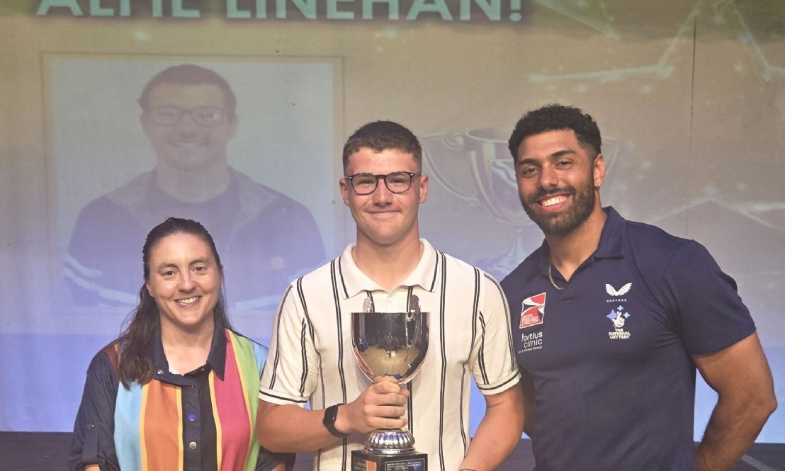 Kennet Sports Personality of the Year holding trophy, standing between the Headteacher and Leon Greenwood of  British Bobsleigh fame.